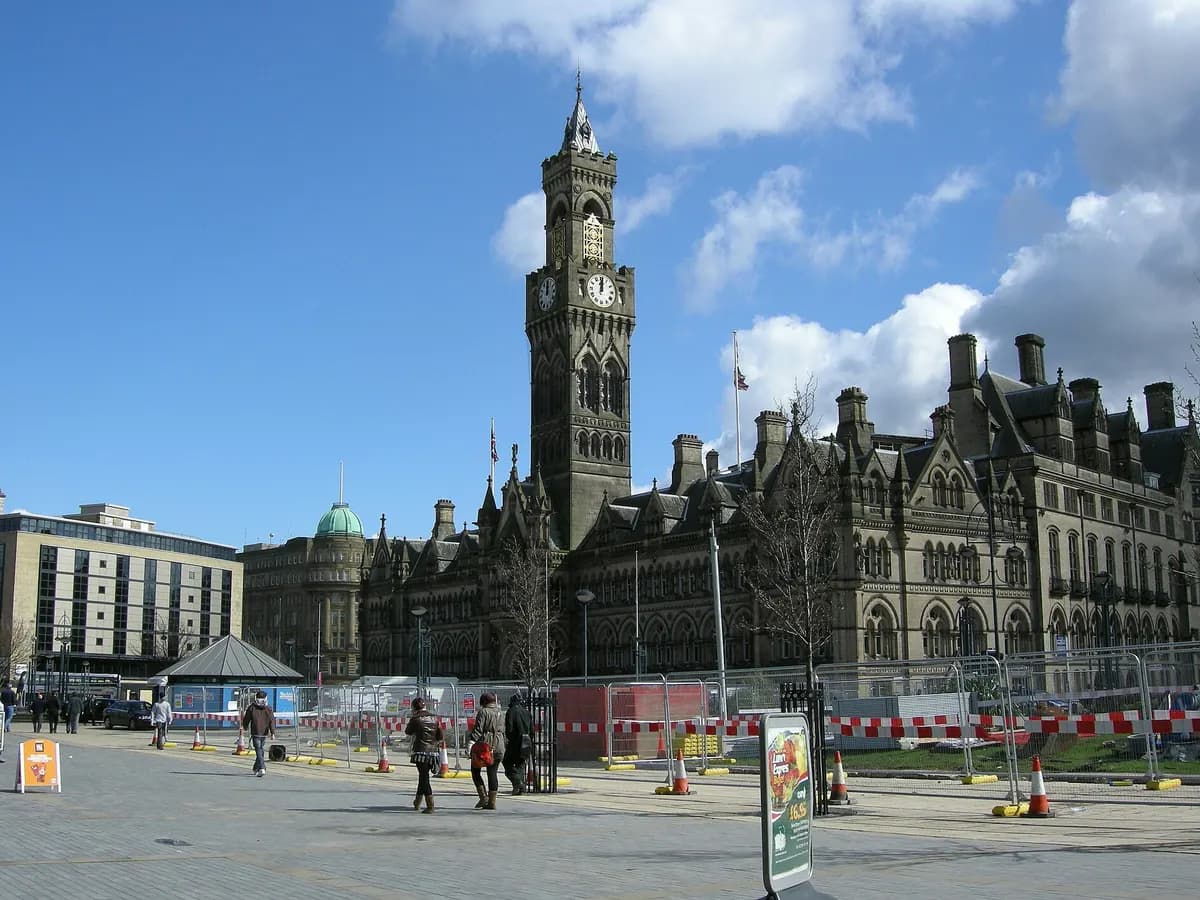 Bradford: honey-coloured sandstone mills with a tall chimney and a domed city hall