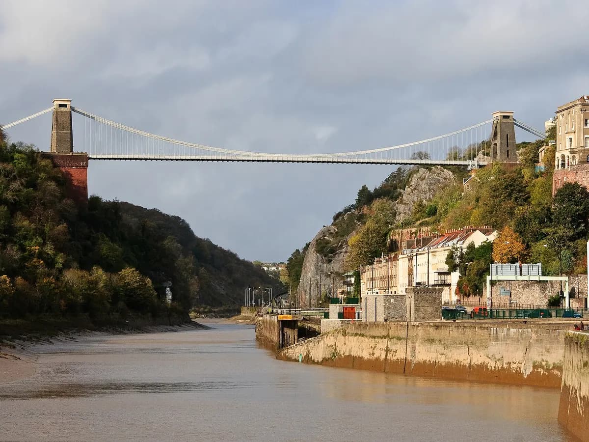Bristol: a suspension bridge across a limestone gorge with coloured terraced houses on the slope