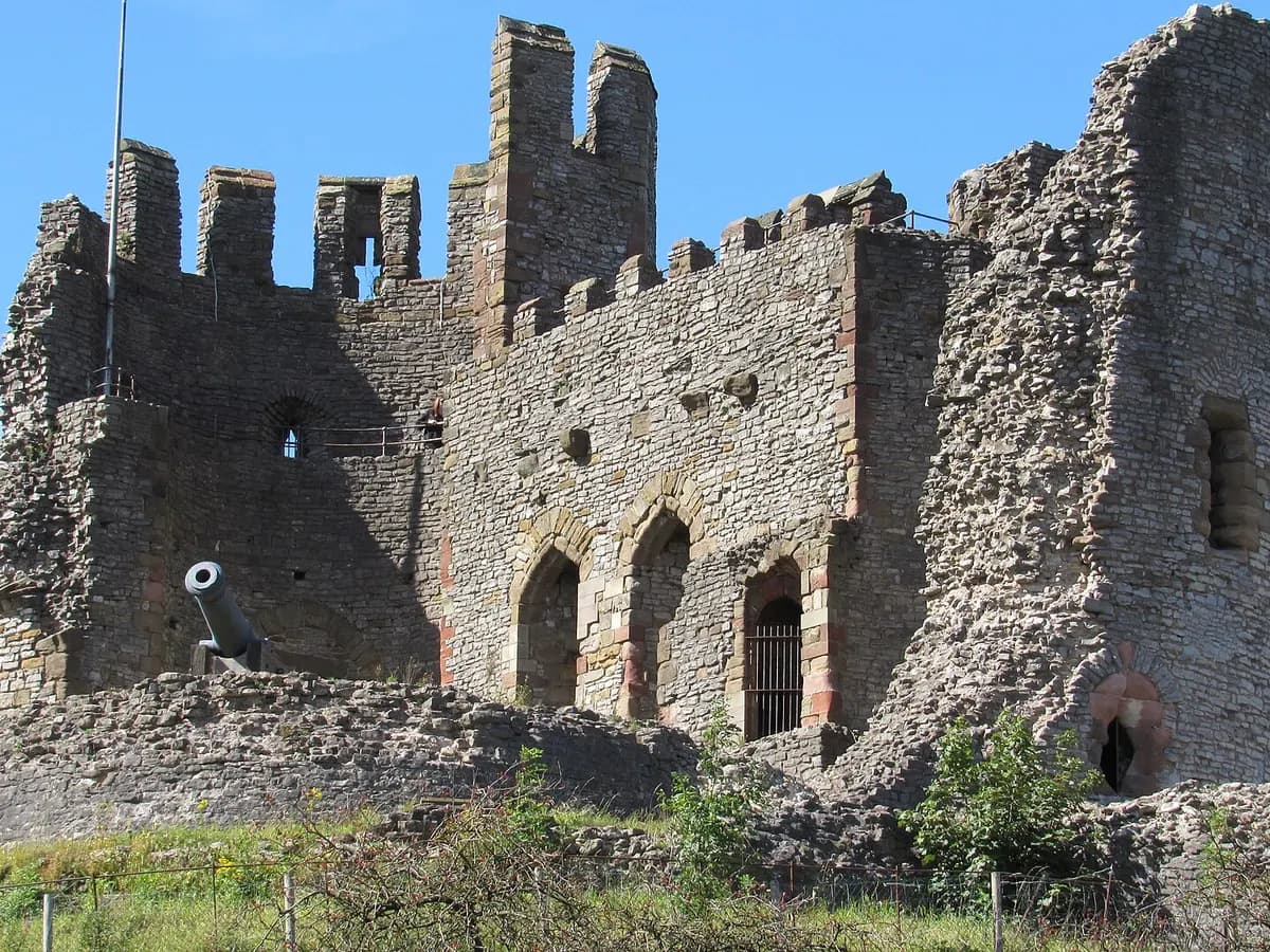 Dudley: a ruined castle keep on a wooded limestone hill above a market town