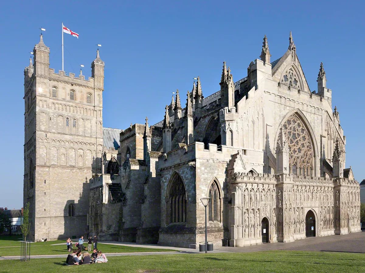 Exeter: a cathedral with two squat Norman towers above a historic quayside