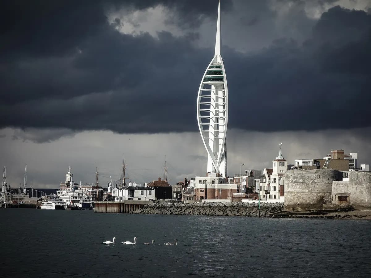 Portsmouth: a slender white tower shaped like a spinnaker sail above a harbour full of masts