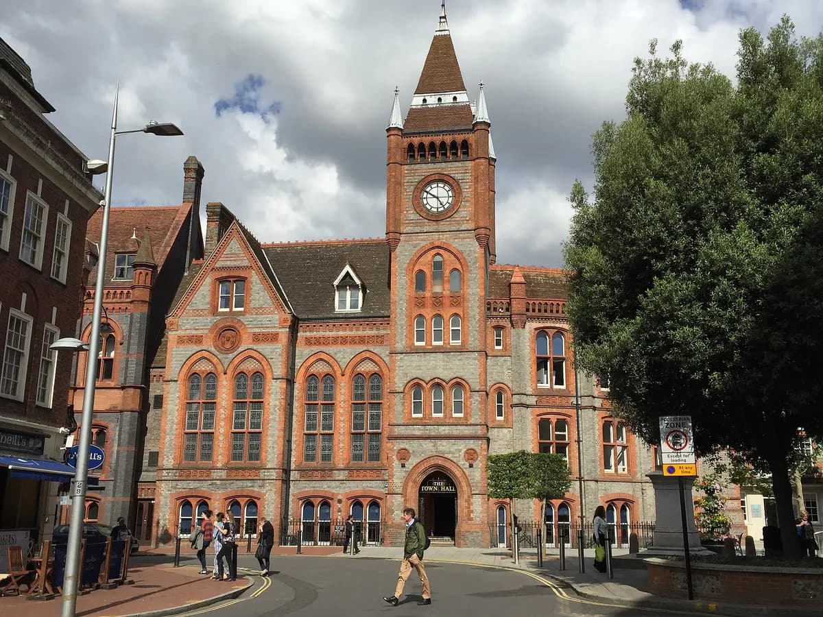 Reading: an abbey ruin in a park where two rivers meet, modern offices rising behind