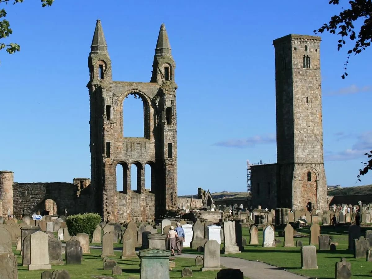St Andrews: cathedral ruins and a ruined castle on a cliff above a links golf course and a long beach