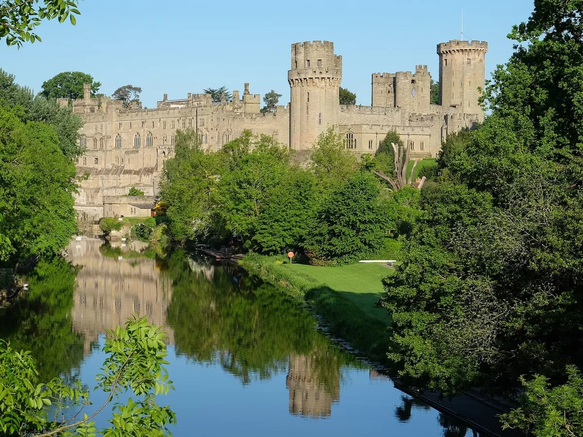 Warwick: a great medieval castle with round towers above a river