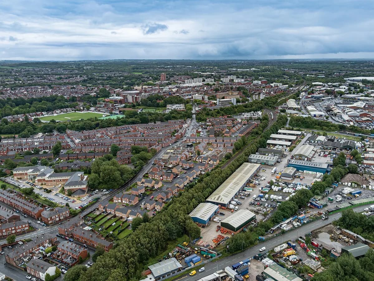 Wigan: canal locks and red-brick mill buildings along a towpath