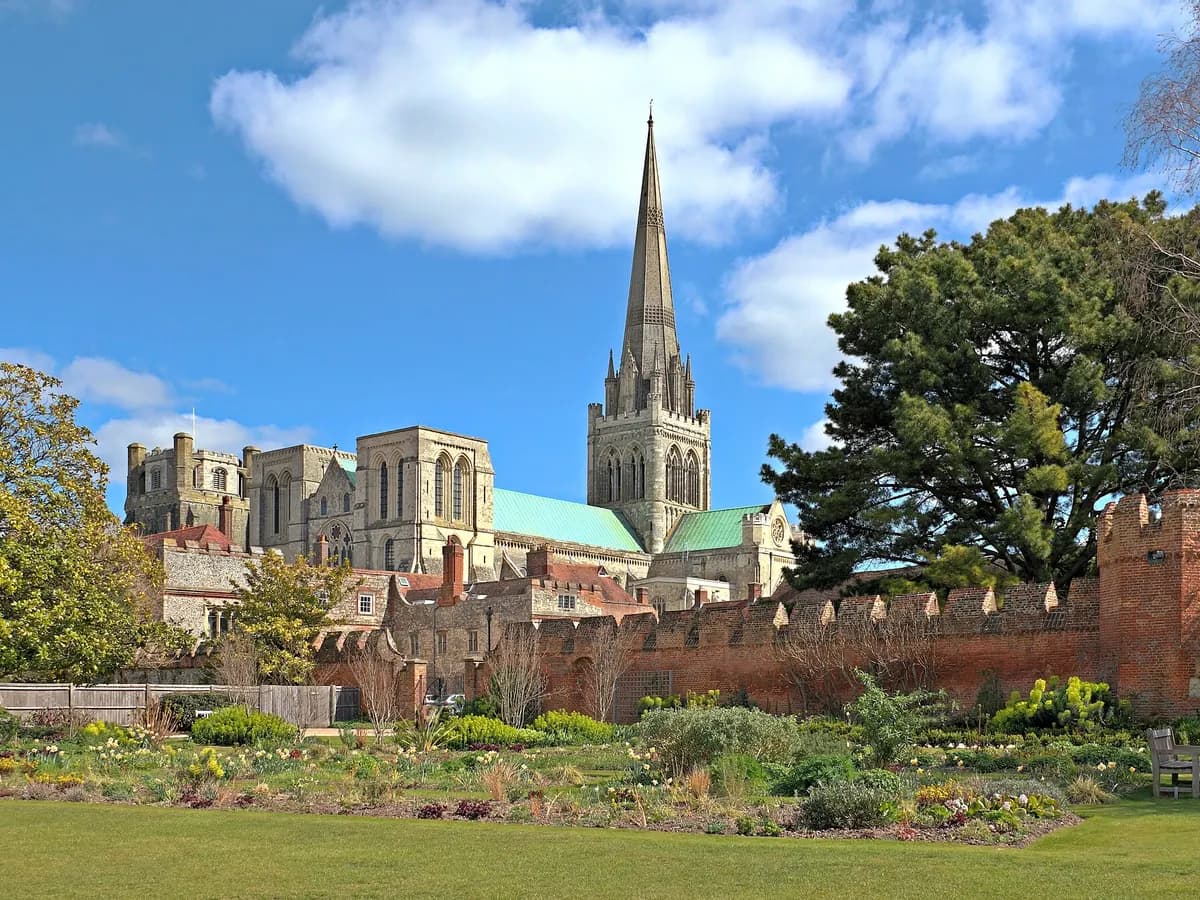 Chichester: a cathedral with a separate stone bell tower beside a covered market cross