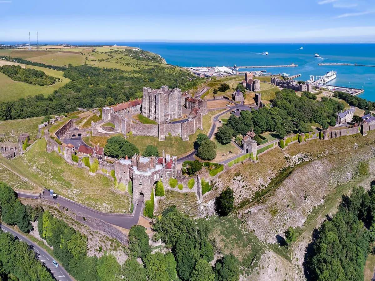 Dover: white chalk cliffs above a harbour, a castle keep on the headland