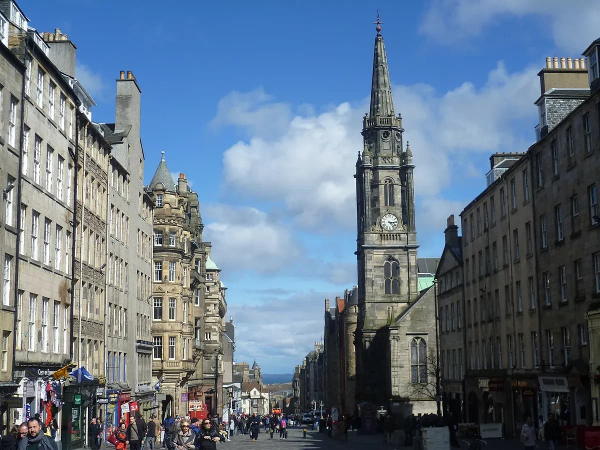 Edinburgh: a castle on a volcanic crag above a long ridge of tall stone tenements