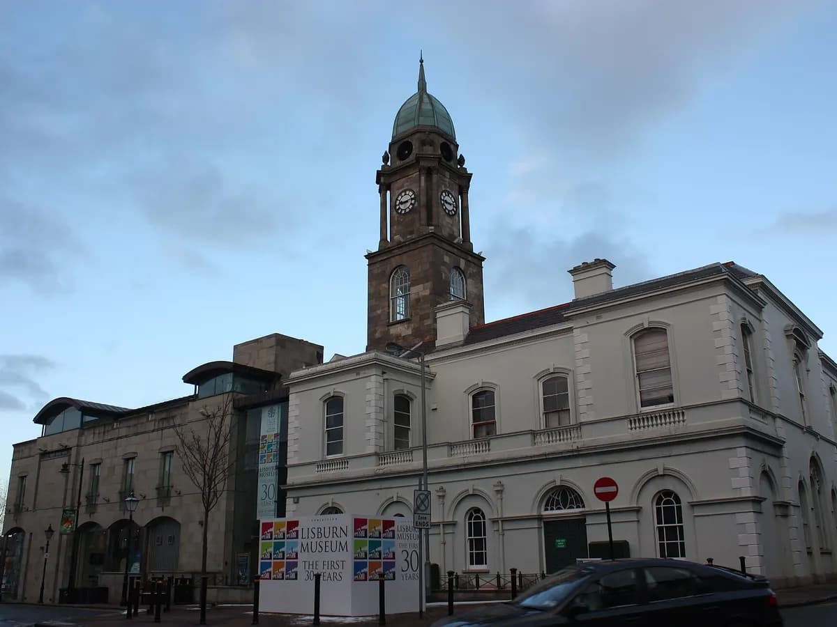 Lisburn: a market square with an assembly-hall clock tower in a linen-weaving town