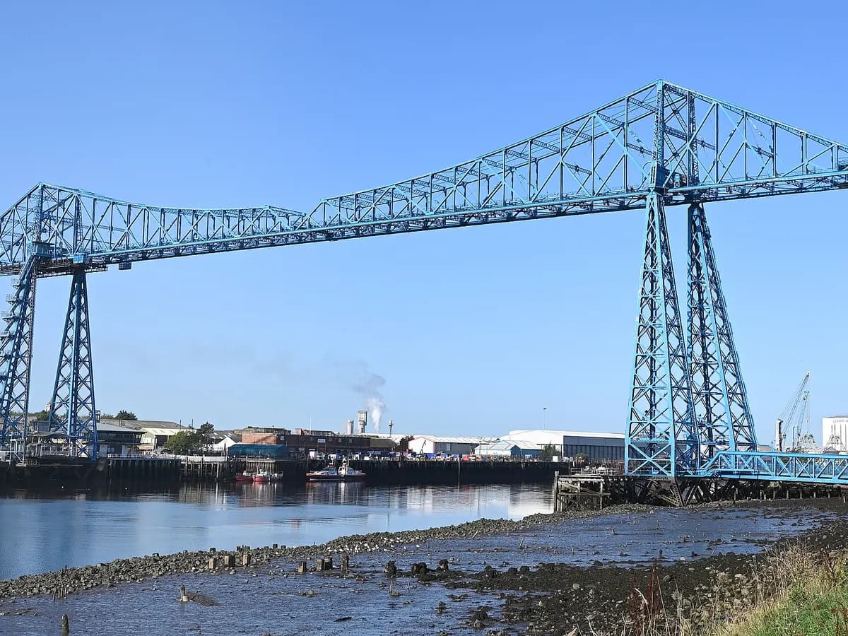 Middlesbrough: a blue steel transporter bridge with its gondola suspended over the river