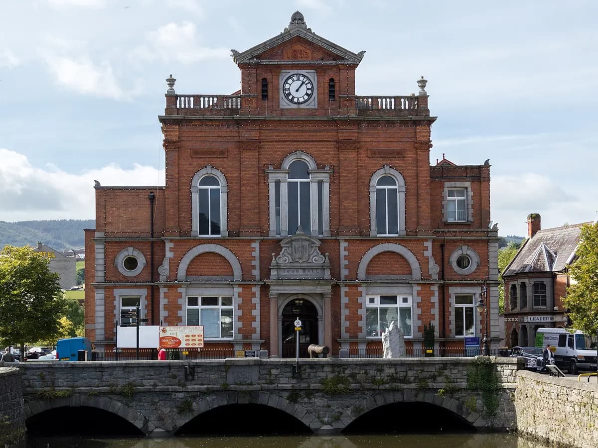 Newry: a canal running through a town between mountains, a cathedral spire above the roofs