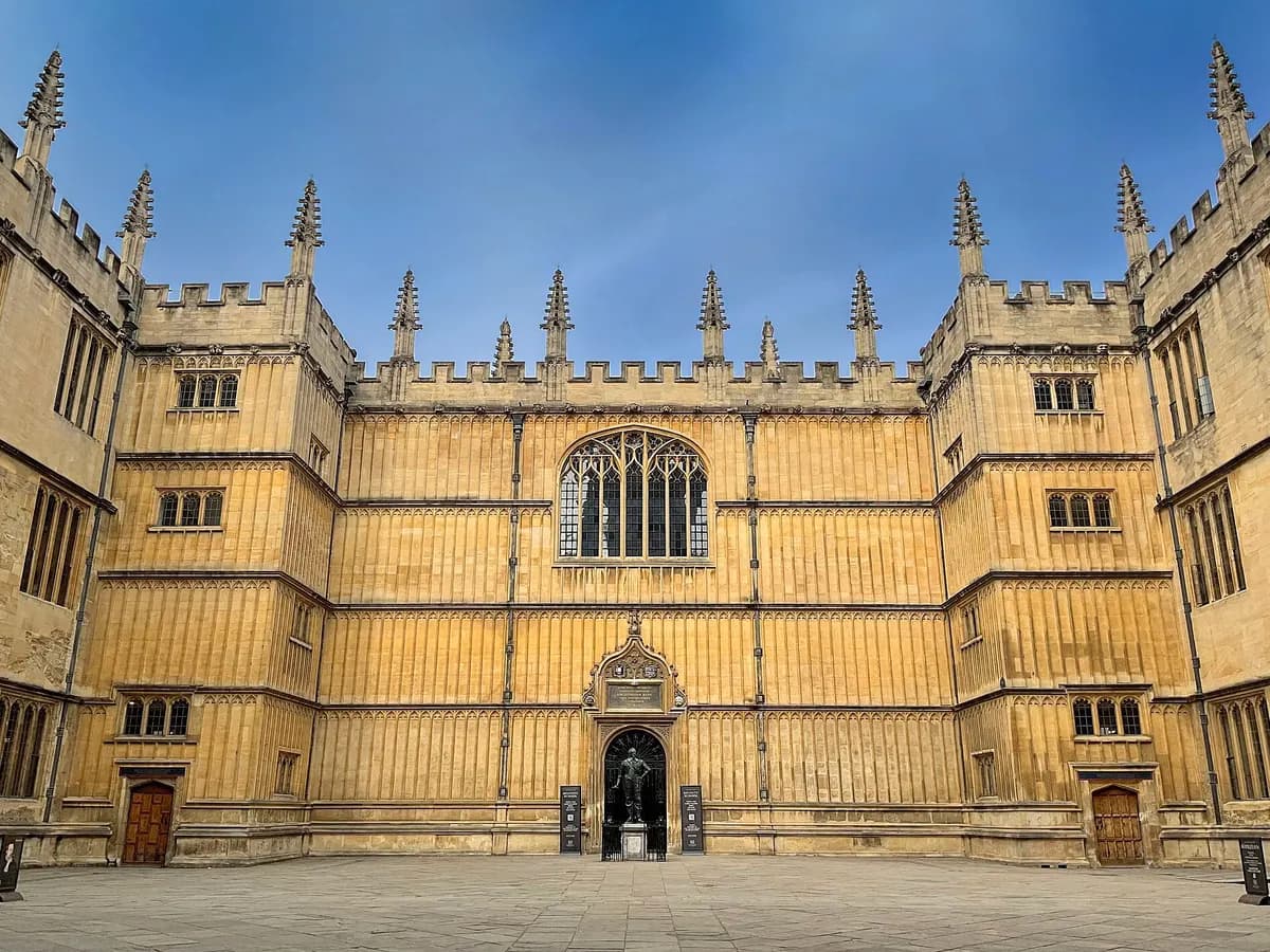 Oxford: honey-coloured college spires around a domed circular library, bicycles leaning against railings