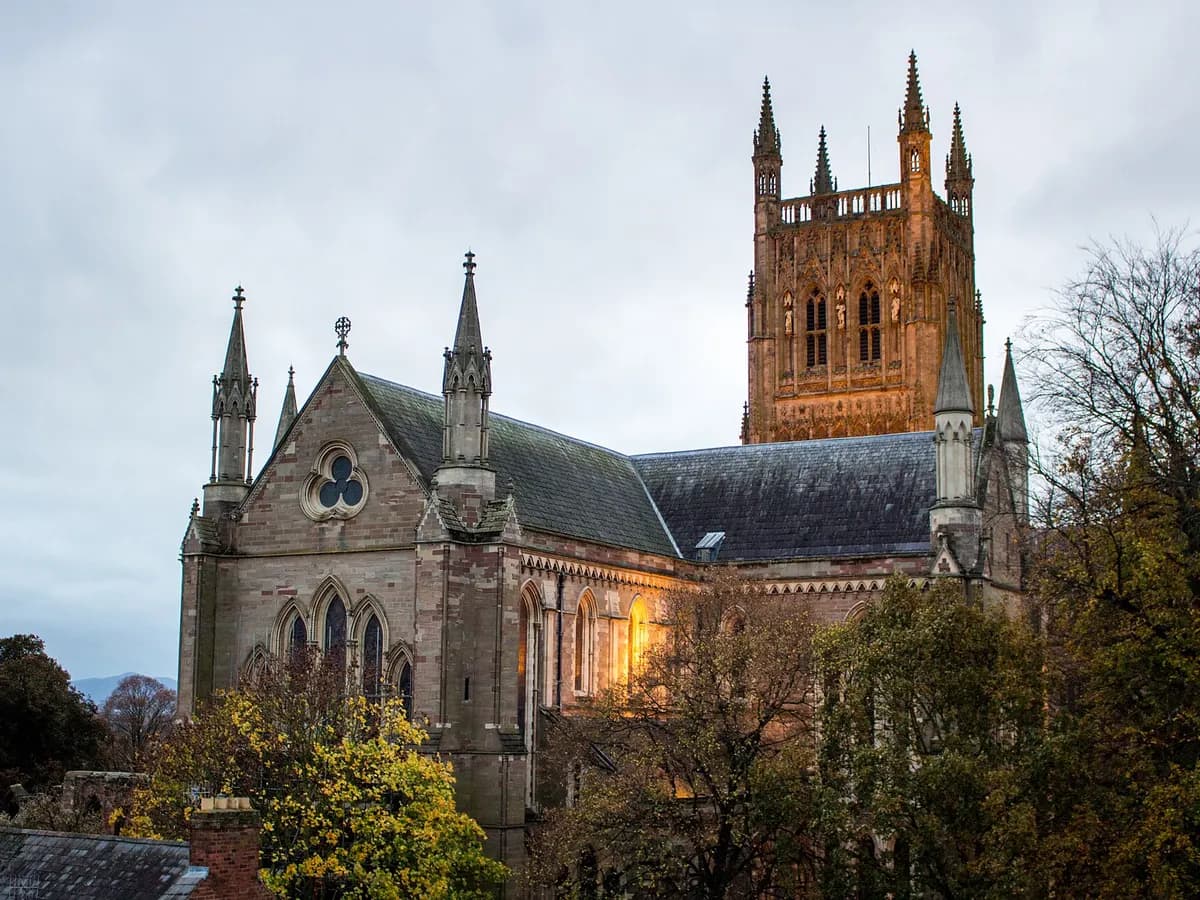 Worcester: a cathedral tower above a river with a county cricket ground on the far bank